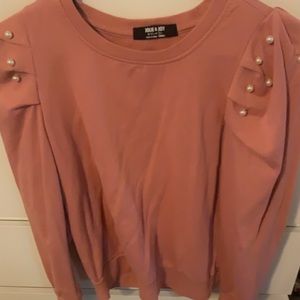 cute pink sweater with pearls on shoulder sleeve